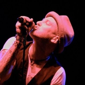 Chris performing on stage