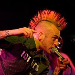 Chris as punk frontman with mohawk
