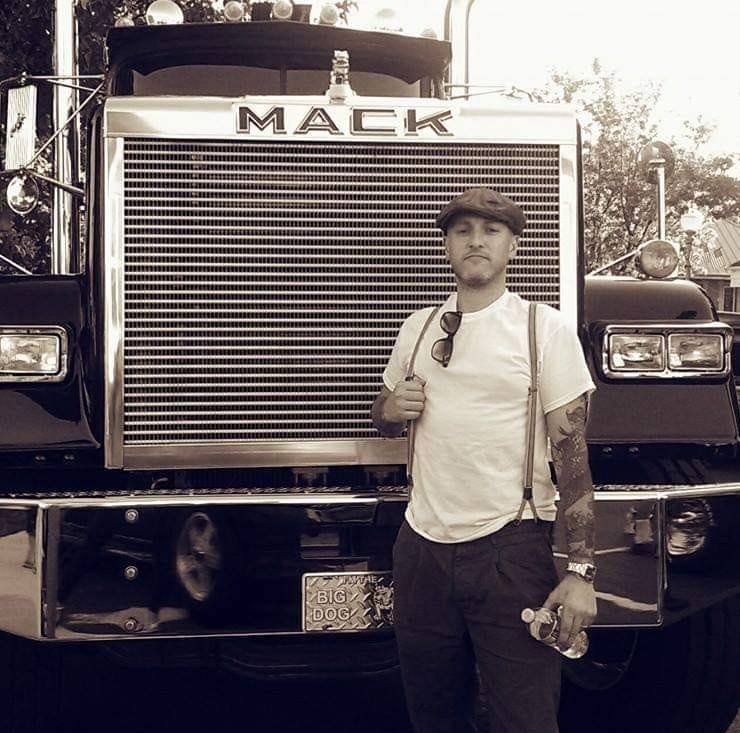 Chris in front of a Mack truck